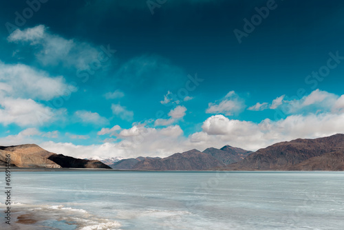 Icy Tranquility: A Captivating View of Frozen Pangong Lake under the Sunny Sky © PrabhjitSingh