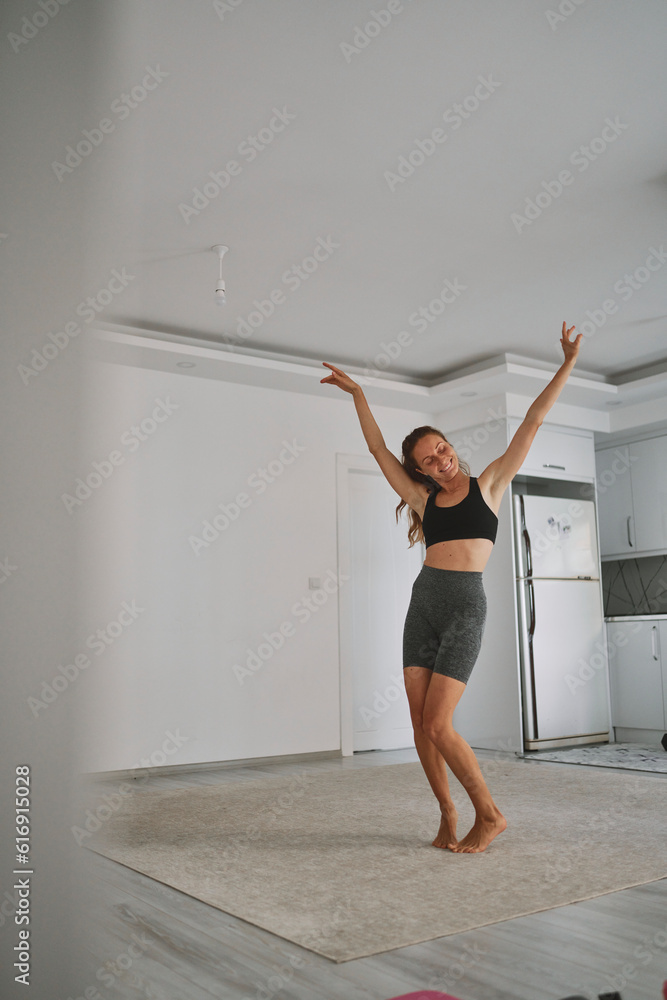 Happy young woman dancing and having fun at home Happy young woman dancing and having fun at home