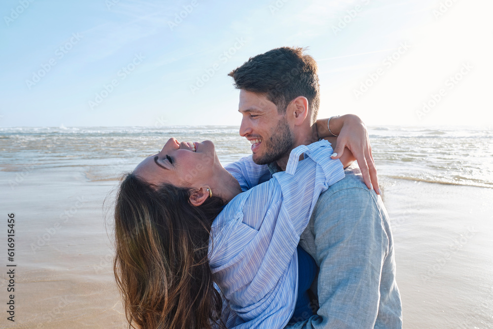 Happy couple embracing each other at beach Happy couple embracing each other at beach