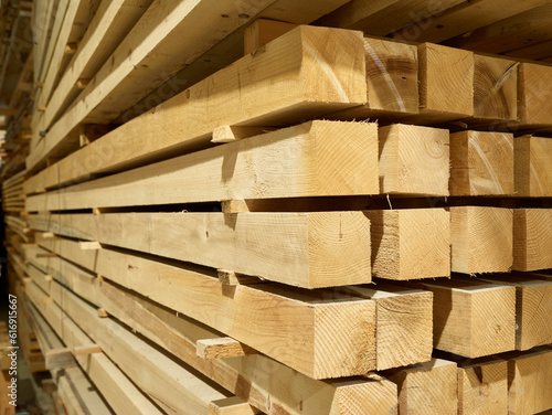 Stacked square shaped timbers in workshop photo