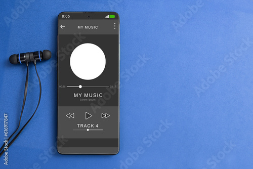 Wired headphones and a phone on the table