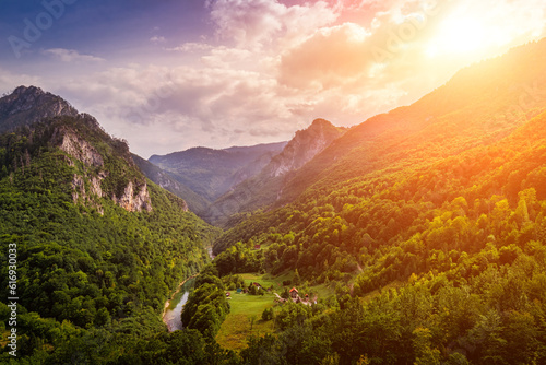 High mountains of Tara river canyon at sunset with cloudy sky. photo