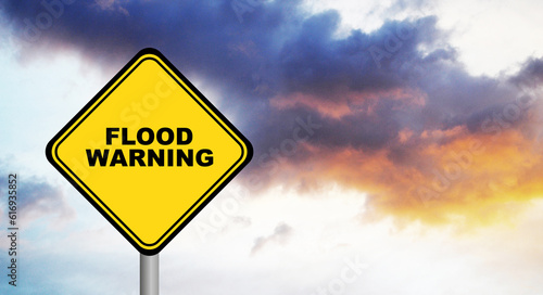 flood warning sign on cloudy sky background	