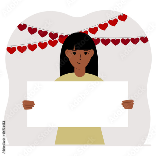 A woman is holding a large blank sheet for text. There are many red hearts nearby. The concept of Happy Women, Valentine's Day, father's day, declaration of love or holiday.