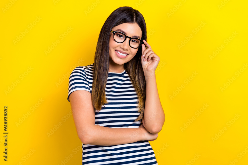 Photo of smart clever lady wear striped dress smiling arm spectacles isolated yellow color background