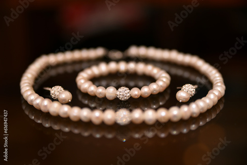 close-up of the bride's pearl jewelry on the table