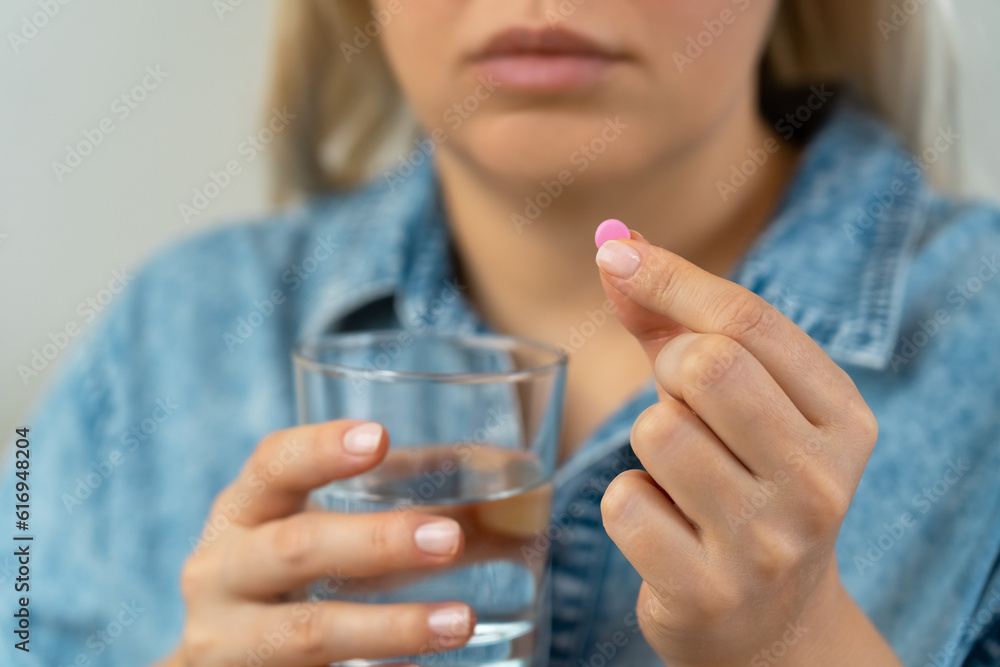 Woman takes pill with water glass. Pills and drugs, medicament, vitamins. Health care Woman takes pill with water glass. Pills and drugs, medicament, vitamins. Health care