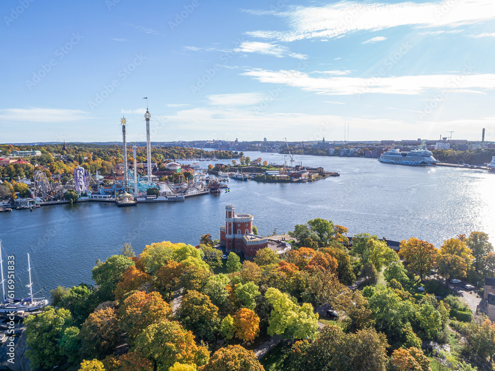 View of amusement park Grona Lund with carousels and tour rides on Djurgarden island Stockholm Sweden View of amusement park Grona Lund with carousels and tour rides on Djurgarden island Stockholm Sweden