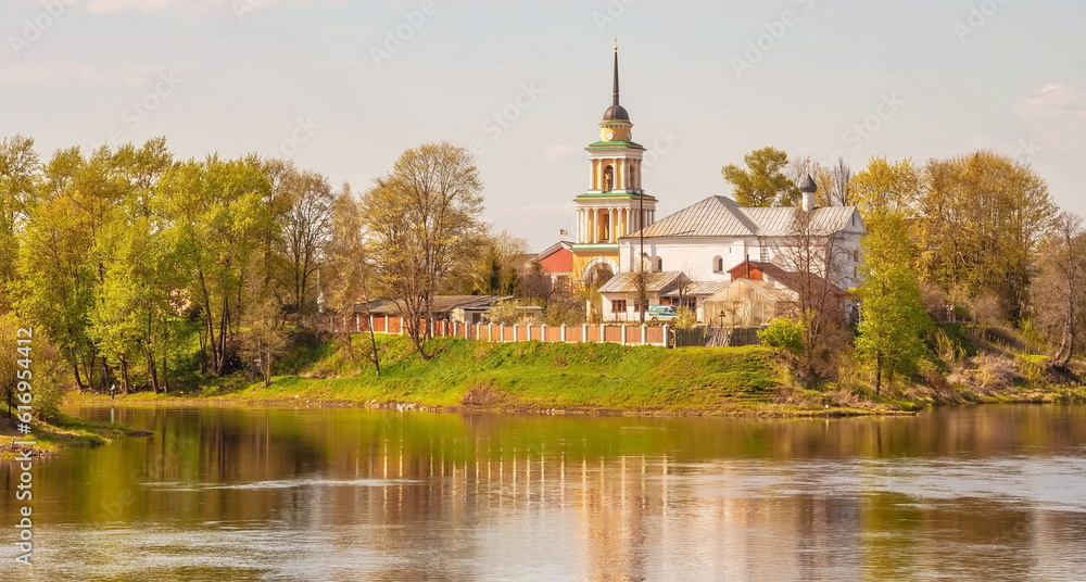 Orthodox church in the bell tower on the river bank