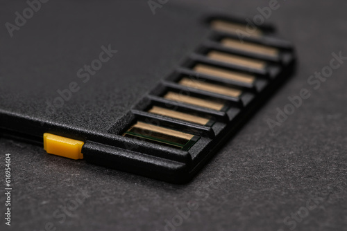 sd card lies on a dark background. close-up