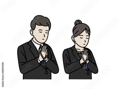 葬儀で合掌、黙祷する男女のイラスト