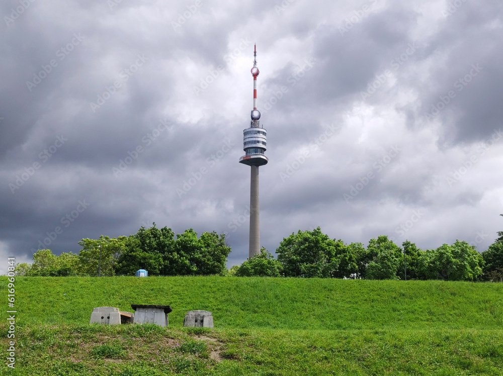Obraz premium view of the Danube Tower in Vienna with cloudy sky in the background
