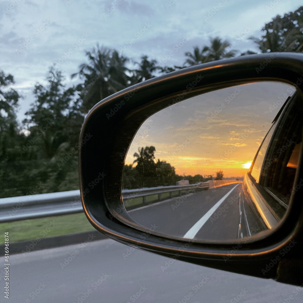Side Mirror of car while driving 