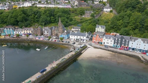 An aerial drone video of Tobermory on the Isle of Mull in Scotland. A small town with colourful houses. 