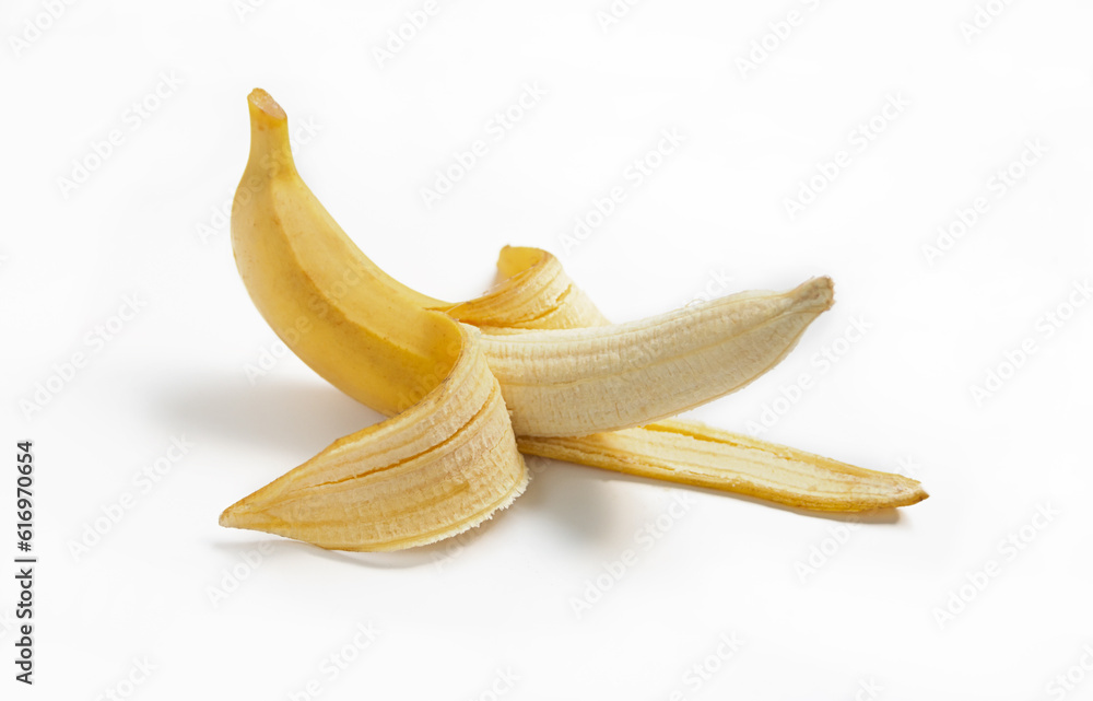 Half peeled ripe banana with peel on a white isolated background Half peeled ripe banana with peel on a white isolated background