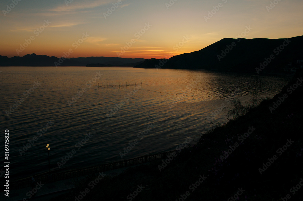 Obraz premium Sunset moody night seascape with a view on the bay.