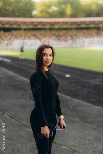 portrait of a beautiful sportswoman on a running track