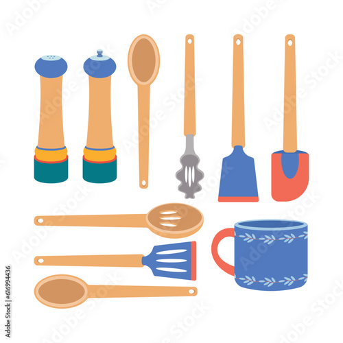 A set of kitchen utensils, a spoon, a mug, a ladle, spatula, salt and pepper shaker.