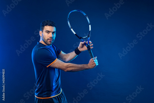 Tennis player banner with blue neon lights. Tennis template for bookmaker design ads with copy space. Mockup for betting advertisement. Sports betting on tenis © Mike Orlov