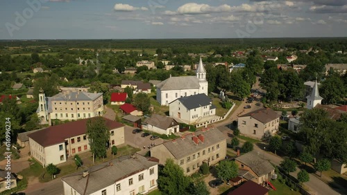 Aerial 4K video from drone to the main square and churches of the city center of Ilukste on a beautiful sunny summer day. Ilukste, Latvia, Selija, Europe photo