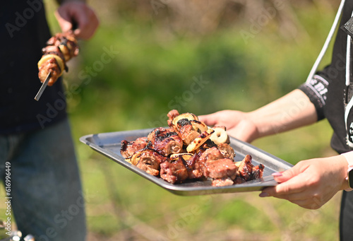 Marinated skewers are prepared on a barbecue gril. Shish kebab made from meat. BBQ grilled beef kebab.