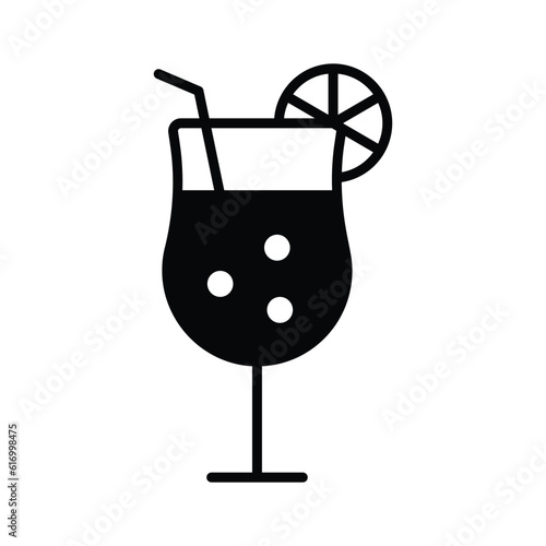 A glass of fresh drink with piece of lemon showing concept icon of cocktail