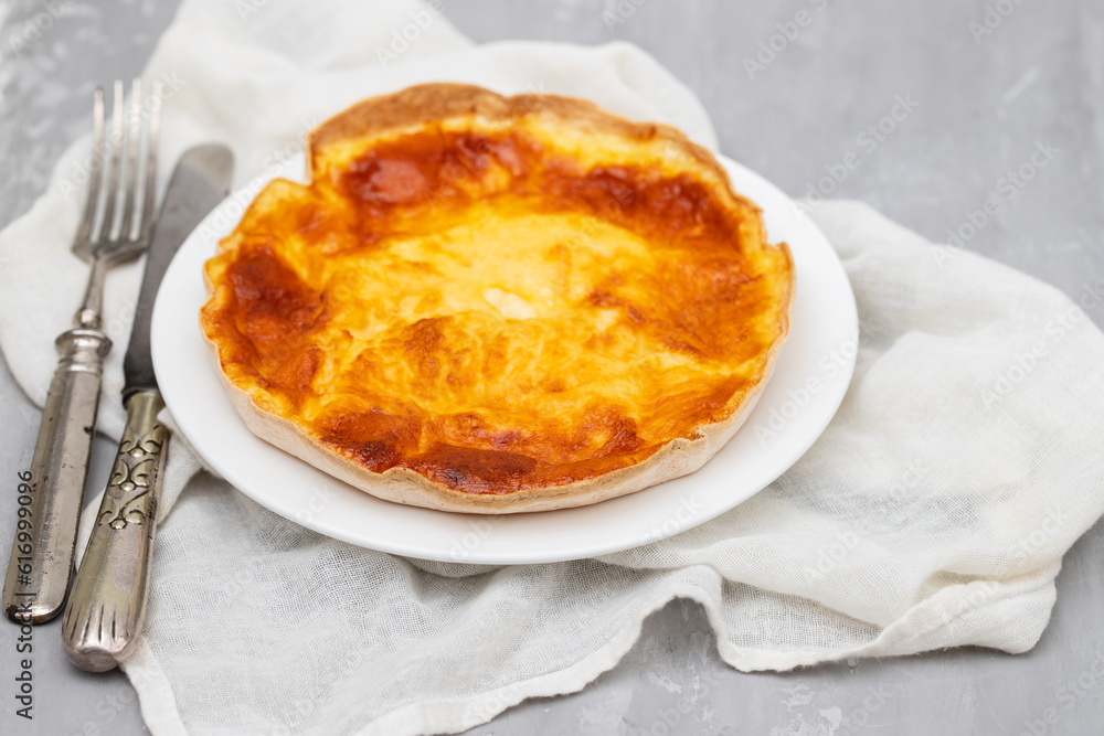 Homemade quiche tart with vegetables and cheese on plate Homemade quiche tart with vegetables and cheese on plate