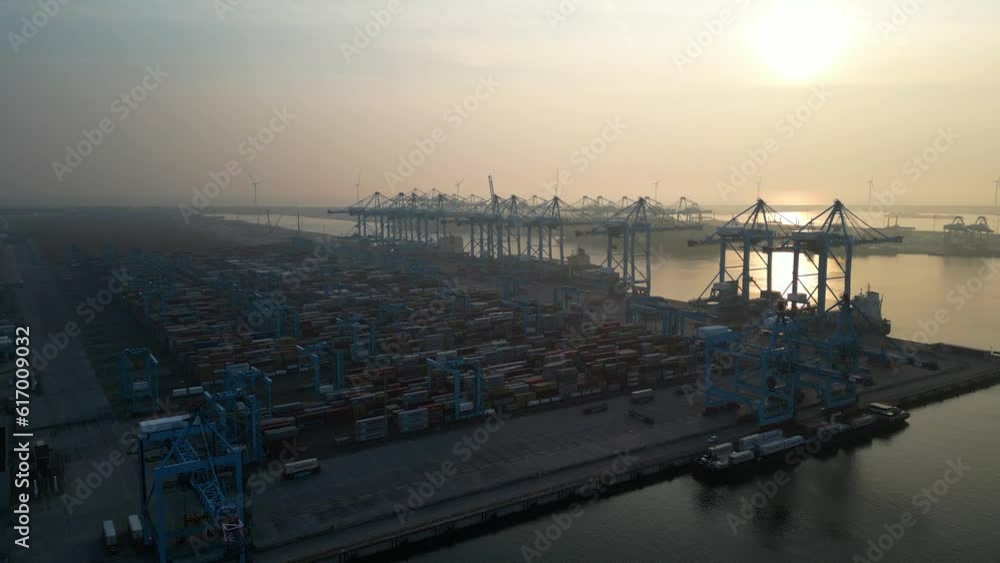 Europoort (Port of Rotterdam) container terminal at sunset, Netherlands Europoort (Port of Rotterdam) container terminal at sunset, Netherlands