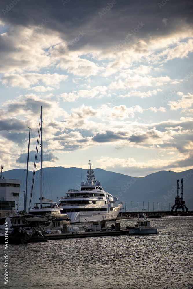 luxury yacht in the harbor at dusk, early summer