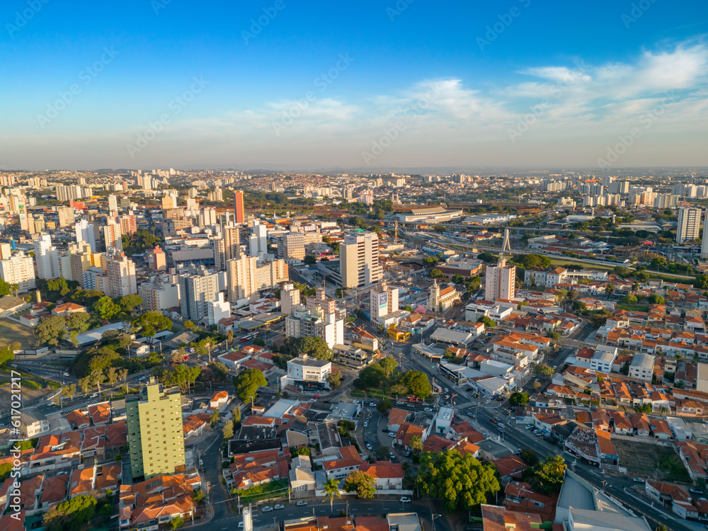 Obraz premium Campinas, Sao Paulo, Brazil. June 23, 2023. Aerial image of three central districts of Campinas: Vila Itapura, Cambuí and Jardim Guanabara. Sunset and blue sky.