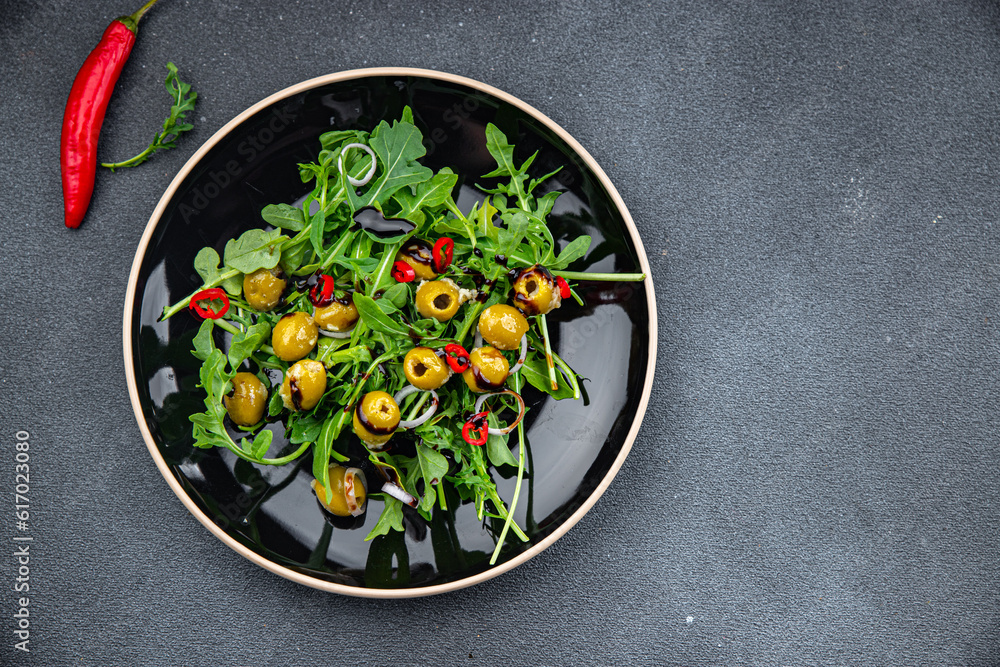 fresh green salad olive, chili pepper, green mix lettuce, arugula meal food snack on the table copy space food background rustic top view fresh green salad olive, chili pepper, green mix lettuce, arugula meal food snack on the table copy space food background rustic top view