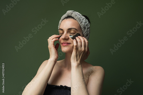 Wallpaper Mural A woman with black collagen pads under her eyes, with a soft cosmetic bandage on her head. Mature skin care, Anti-aging Moisturizing Eye Mask, Black and hydrogel Patches, eye skin care, cosmetologia Torontodigital.ca