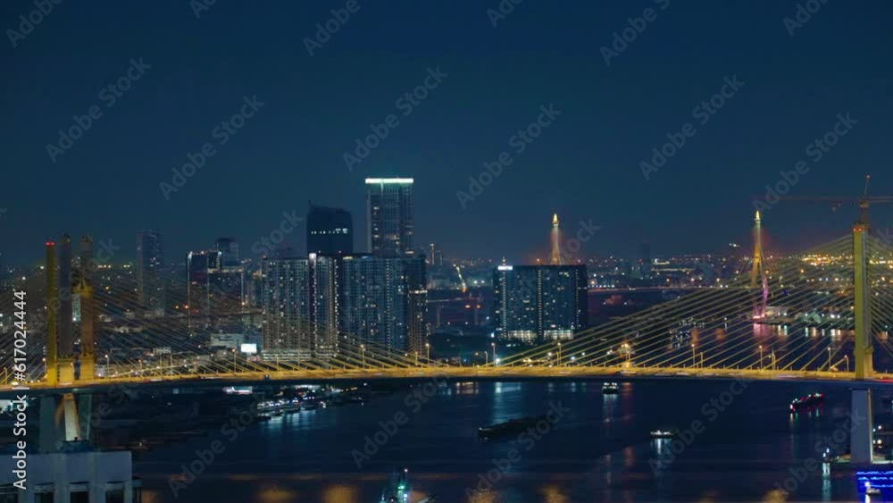 Time lapse 4K aerial view of Bangkok City skyline by Chao Phraya River in Thailand, car traffic transportation above view Timelapse during night on city scape or abstract of advanced innovation Time lapse 4K aerial view of Bangkok City skyline by Chao Phraya River in Thailand, car traffic transportation above view Timelapse during night on city scape or abstract of advanced innovation