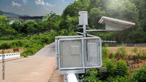 Close up view of water level a measurement and flood warning system installed on the local bridge closed to a community                               