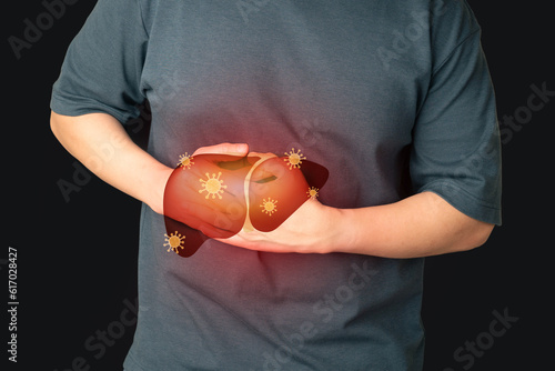 World hepatitis day concept. Man suffering from abdominal pain with liver viral infection symbol. Awareness of prevention and treatment viral hepatitis that causes liver cancer.