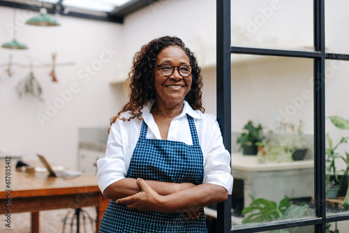Mature small business owner running a successful flower store