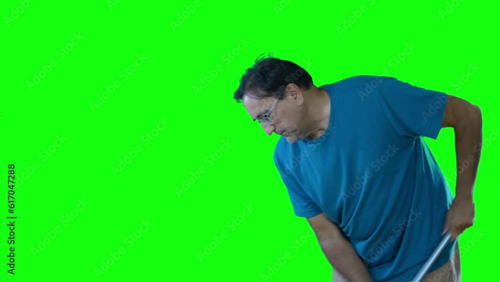 A man sweeps the floor from right to left. Green screen transition. A man sweeps the floor from right to left. Green screen transition.