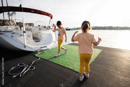 Two girls kids having fun on the pier of Nessebar. © AS Photo Family