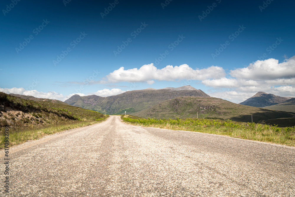 A hot, summer HDR image of the A896, the road between Shieldaig and Loch Carron on the NC500, Glenshieldaig, Wester Ross, Scotland. 6th June 2023