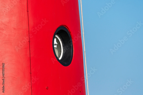 Detail of the cast iron red lighthouse of Schiermonnikoog after a paint job, Friesland, The Netherlands.