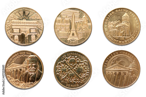 Paris, France. Paris coins. Tourist attractions and celebrities engraved in golden metal. Arc de Triomphe, Eifel Tower, Montmartre, The Catacombs, Victor Hugo and Pantheon. Transparent background. 