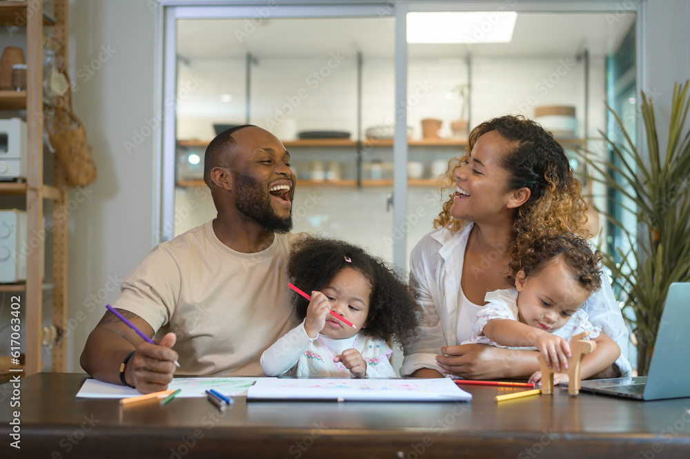 Happy African American parent playing and drawing with daughters in home Happy African American parent playing and drawing with daughters in home