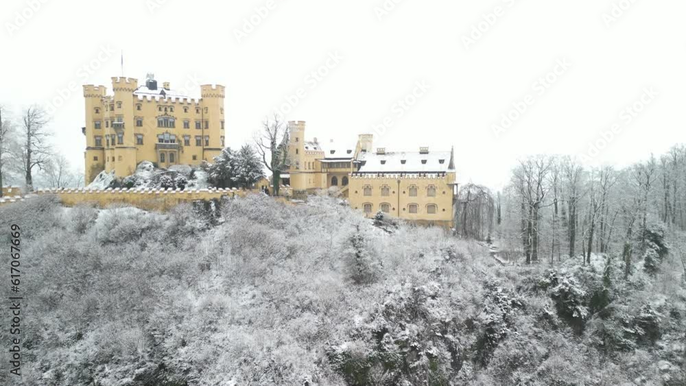 Aerial View from Hohenschwangau Castle recorded in winter with light snow covered mountains and bare trees in the alpine in the south of Bavaria Aerial View from Hohenschwangau Castle recorded in winter with light snow covered mountains and bare trees in the alpine in the south of Bavaria
