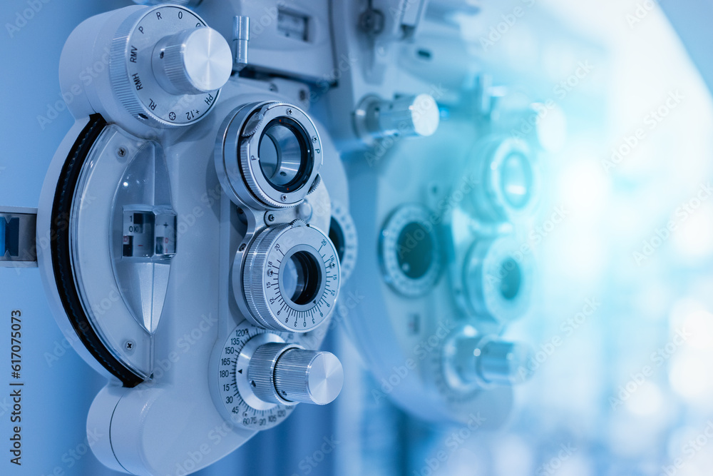 Phoropter eyesight measurement testing machine, Eye health check and ophthalmology concept. Web banner size. Copy space. Phoropter eyesight measurement testing machine, Eye health check and ophthalmology concept. Web banner size. Copy space.