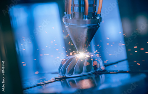 Bild auf Leinwand A modern 3D printer is printing a metal turbine