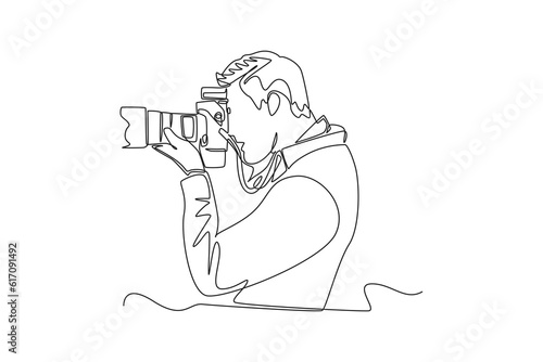 Single one line drawing  Photographer with camera. World photography day concept. Continuous line draw design graphic vector illustration.