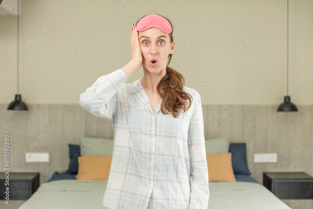 feeling extremely shocked and surprised. pajamas or night wear concept feeling extremely shocked and surprised. pajamas or night wear concept
