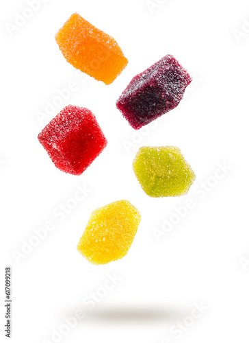 assorted jelly candies floating on white background.