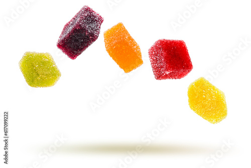assorted jelly candies floating on white background. photo