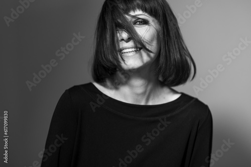 Portrait of an adult woman black and white on a black background